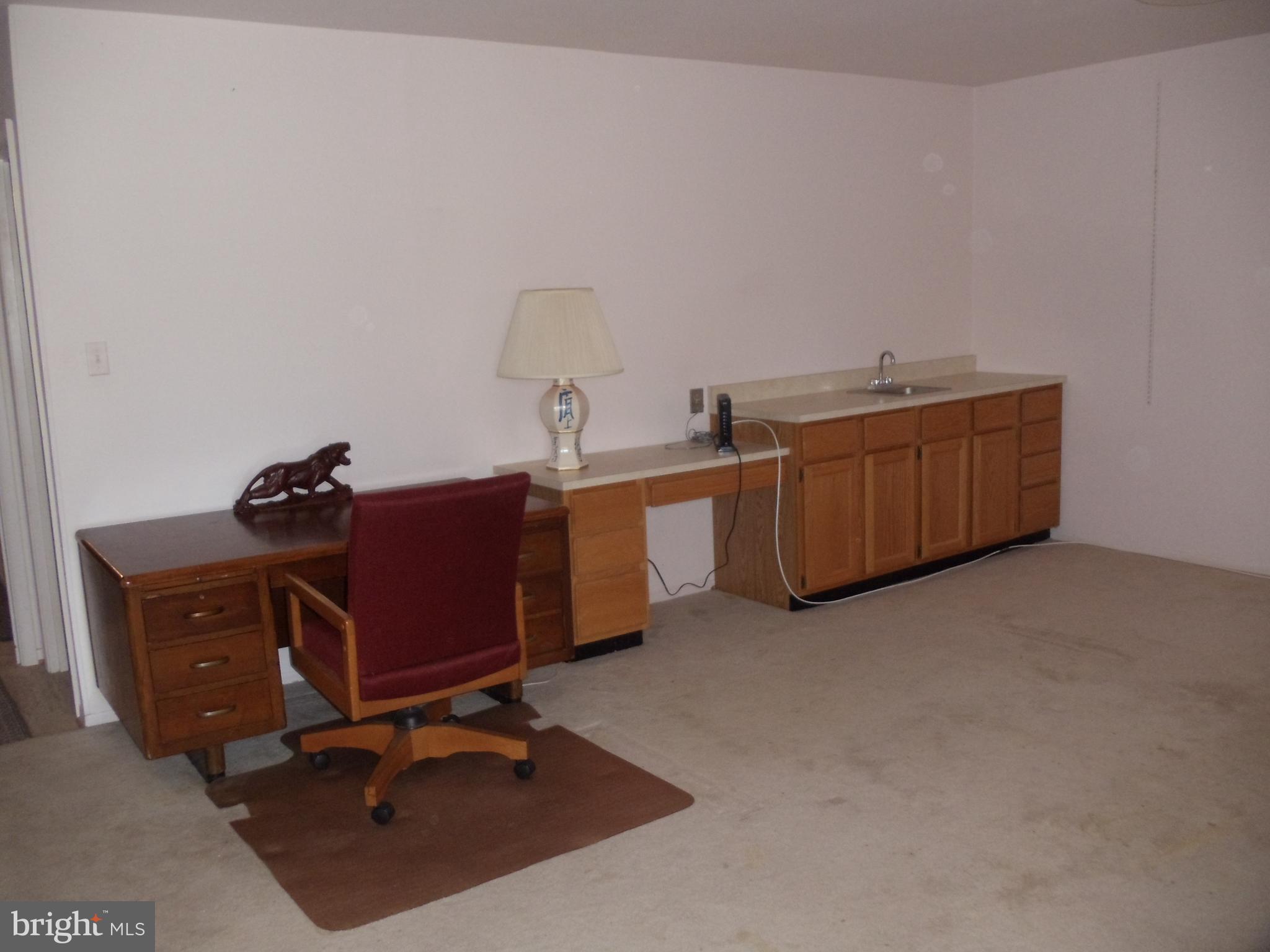 2186 Golf Course Drive Reston, VA 20191 - Photo 28 of 30 a room with a desk and a chair