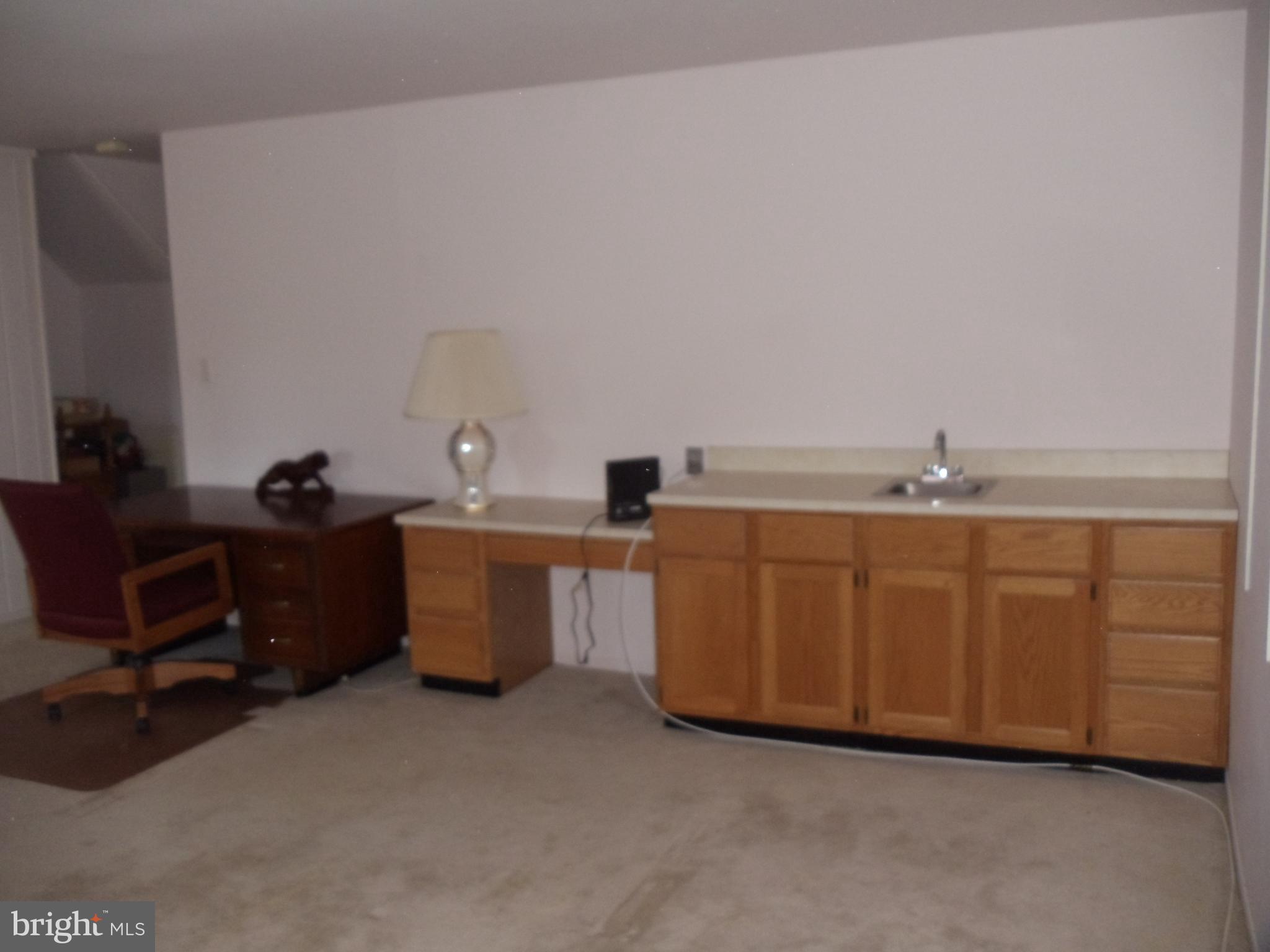 2186 Golf Course Drive Reston, VA 20191 - Photo 29 of 30 a room with a sink and a cabinet