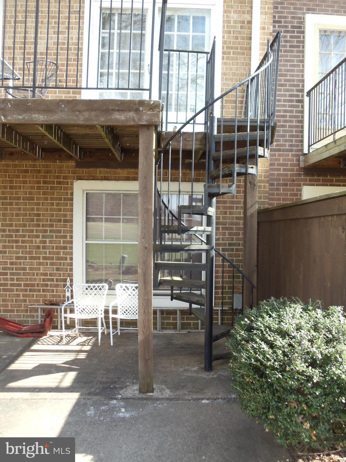 2186 Golf Course Drive Reston, VA 20191 - Photo 4 of 30 a backyard of a house with table and chairs