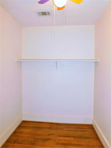 a bathroom with a granite countertop sink a toilet and bathtub