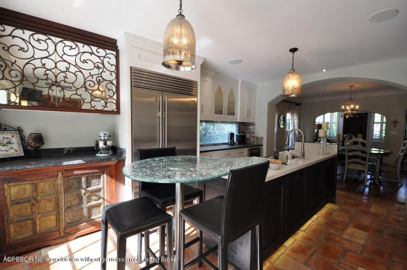 272 Cordova Road West Palm Beach, FL 33401 - Photo 6 of 15 a kitchen with stainless steel appliances granite countertop a sink stove and refrigerator