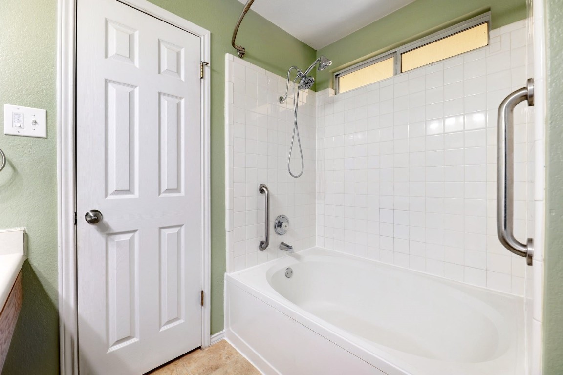 301 Nicole Way Bastrop, TX 78602 - Photo 14 of 23 a bathroom with a shower and a tub
