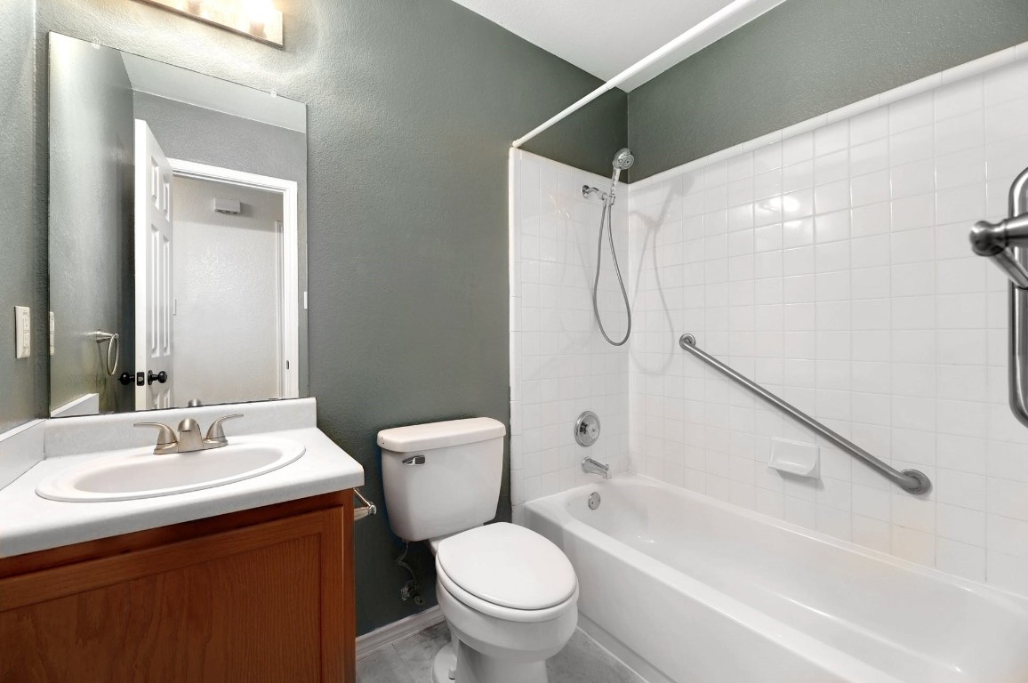301 Nicole Way Bastrop, TX 78602 - Photo 17 of 23 a bathroom with a sink toilet and shower