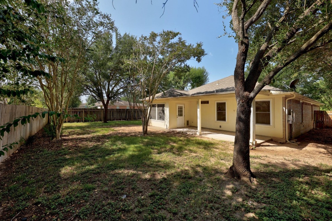 301 Nicole Way Bastrop, TX 78602 - Photo 22 of 23 a view of a house with a yard