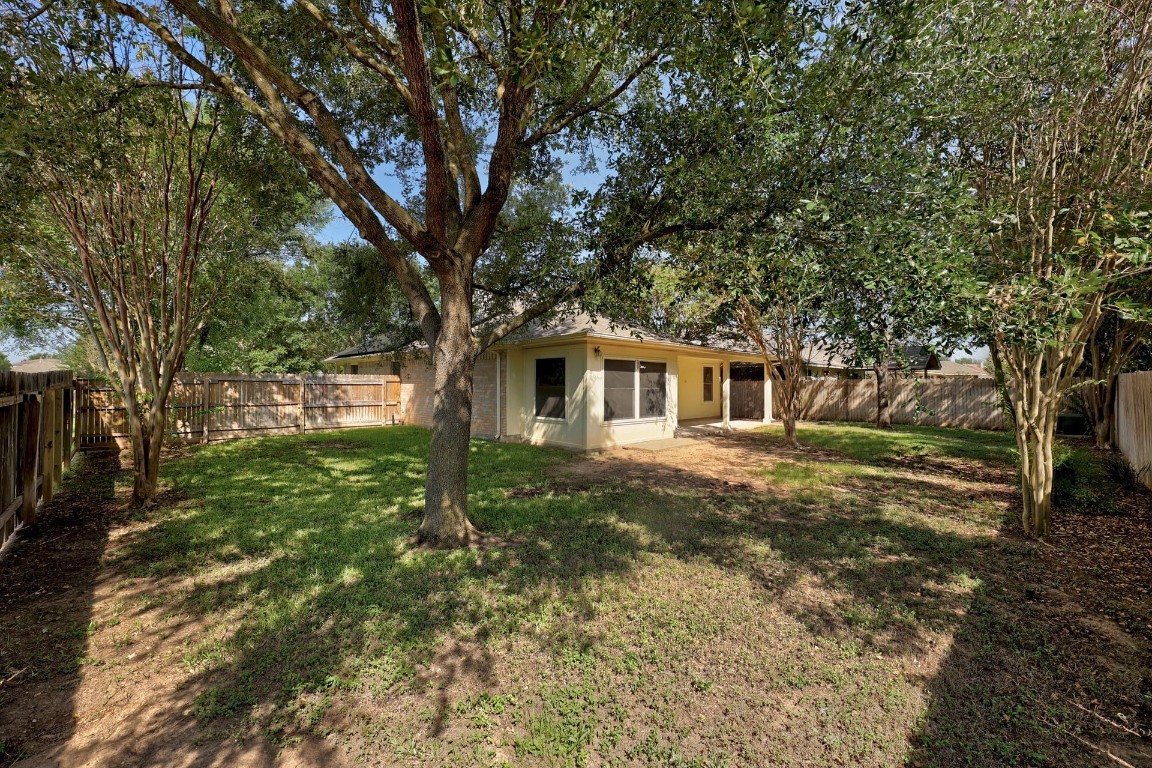 301 Nicole Way Bastrop, TX 78602 - Photo 23 of 23 a front view of a house with garden