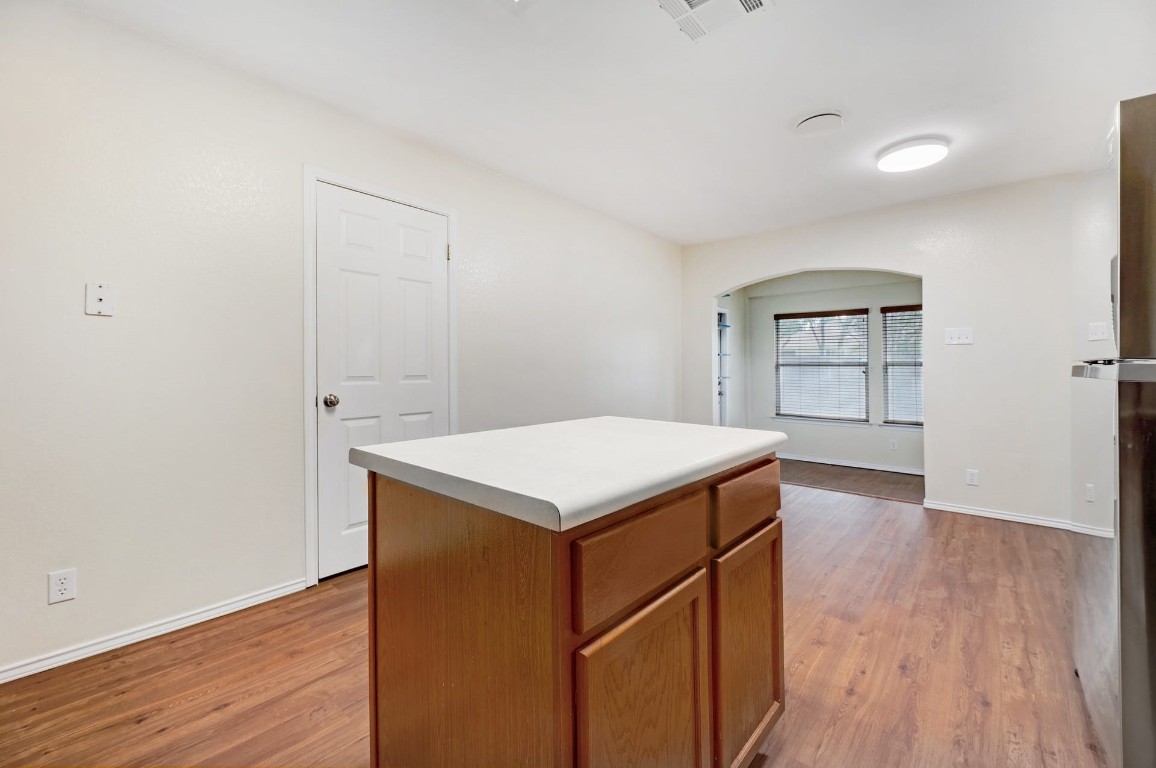301 Nicole Way Bastrop, TX 78602 - Photo 9 of 23 a utility room with wooden floor and window