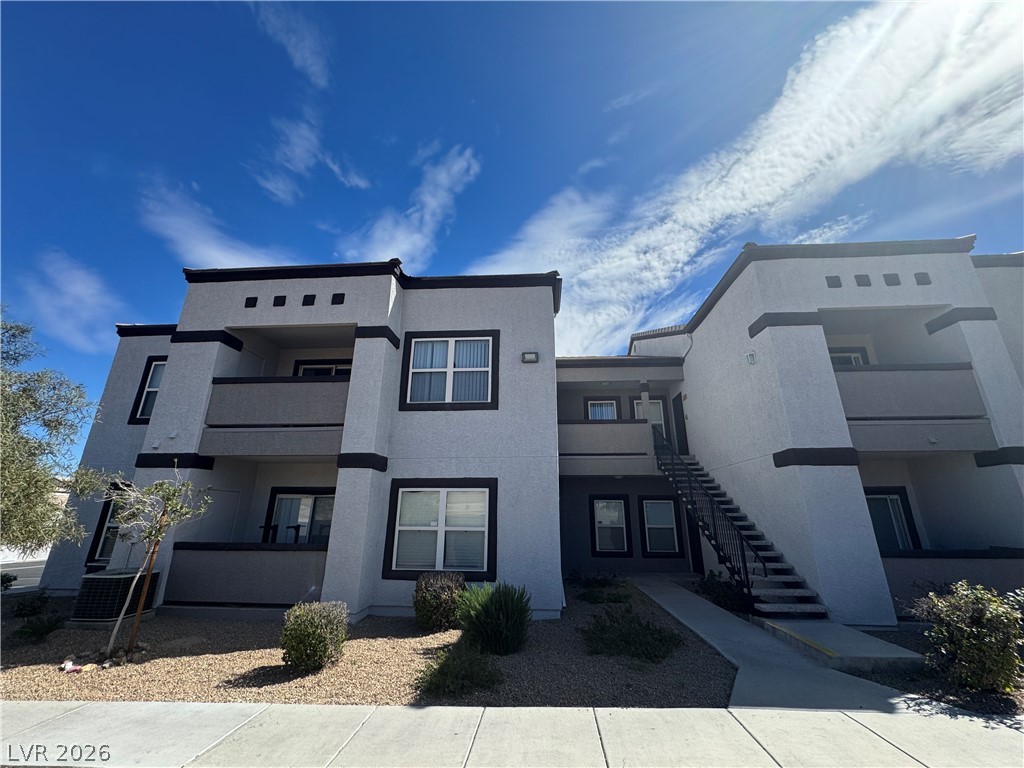 View of apartment building / complex with stairs