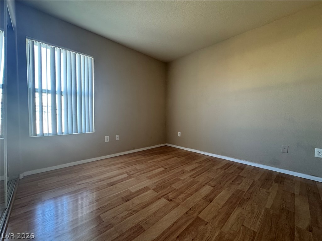 7255 West Sunset Road, Unit 2081 Las Vegas, NV 89113 - Photo 15 of 20 Unfurnished room featuring light wood-style flooring