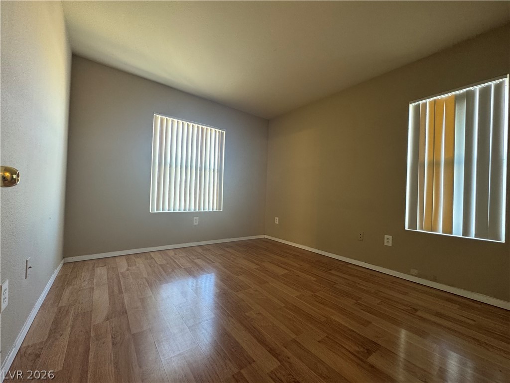 7255 West Sunset Road, Unit 2081 Las Vegas, NV 89113 - Photo 18 of 20 Unfurnished room with wood finished floors and baseboards
