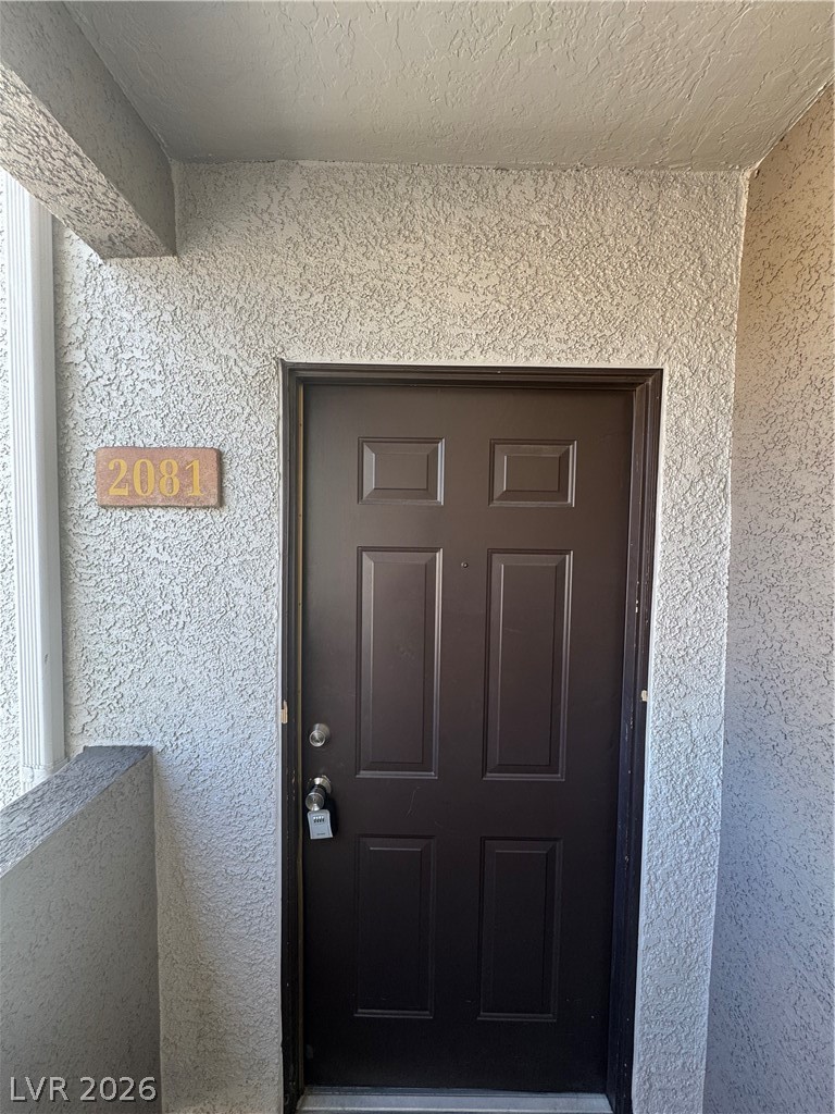 7255 West Sunset Road, Unit 2081 Las Vegas, NV 89113 - Photo 2 of 20 Property entrance with stucco siding