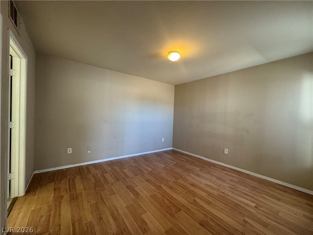 7255 West Sunset Road, Unit 2081 Las Vegas, NV 89113 - Photo 8 of 20 Spare room featuring light wood-style flooring and baseboards