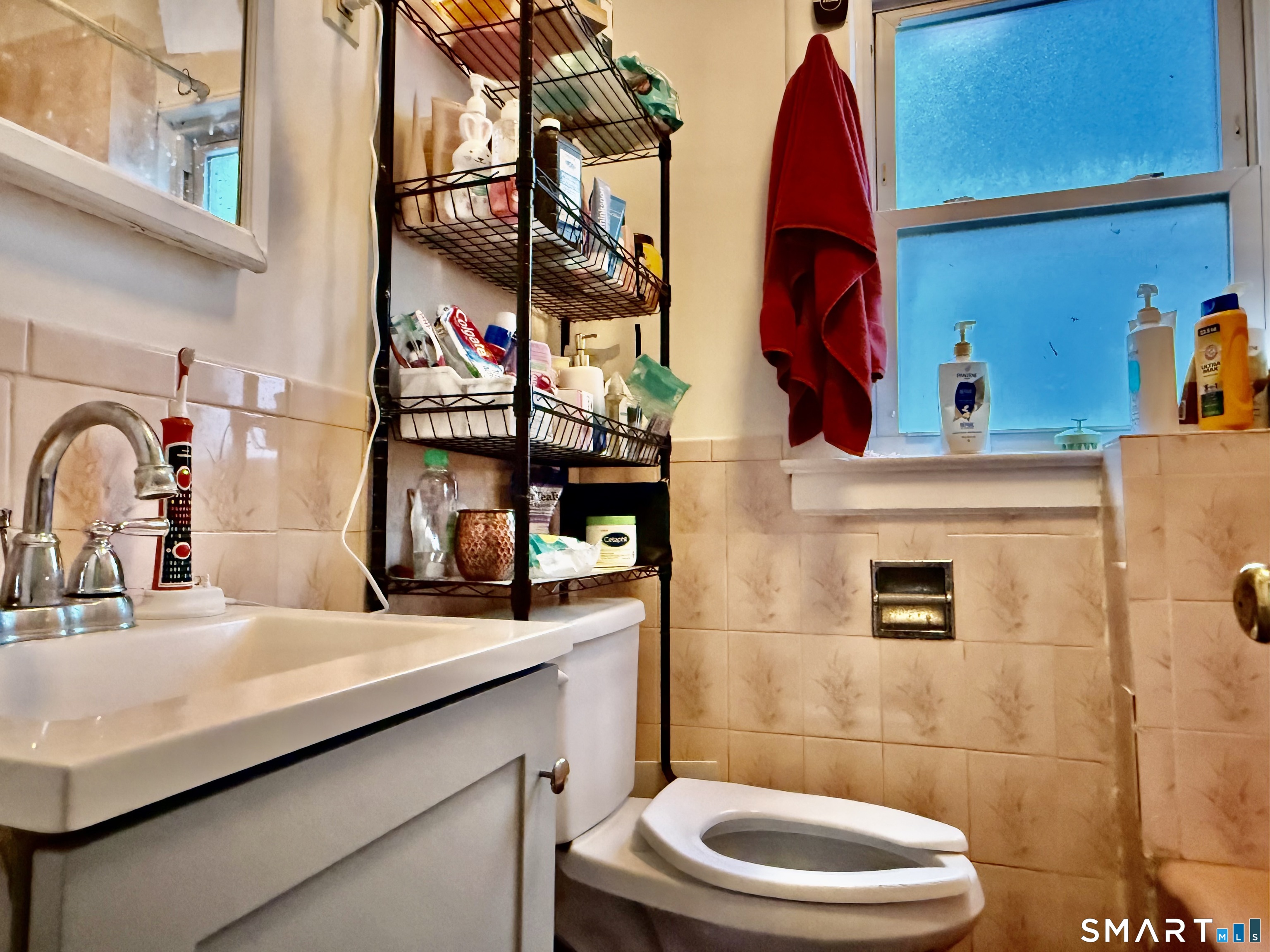 60 Stephen Street Stamford, CT 06902 - Photo 22 of 29 1st Fl Full Bathroom with New Sink Cabinet, New faucet, New Toilet, New Exhaust Fan and New Painting