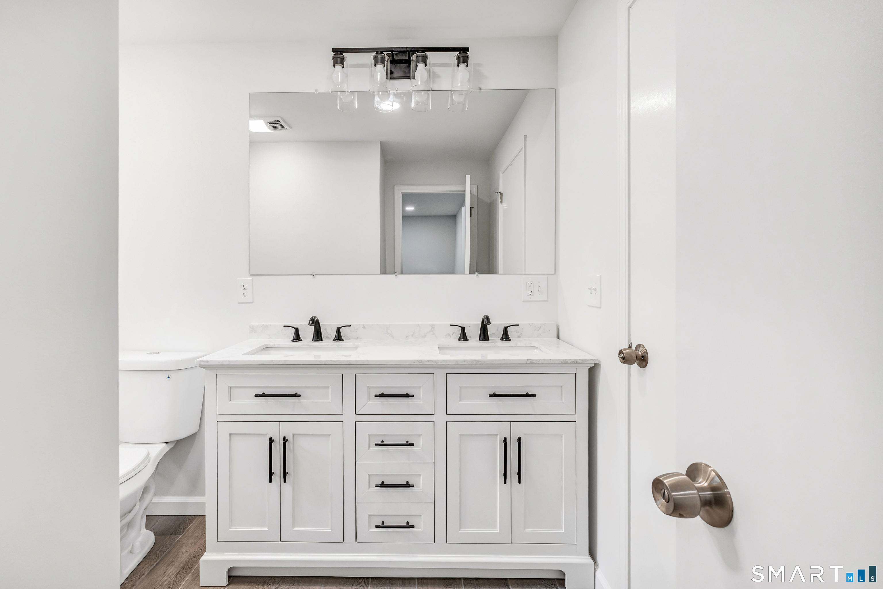 7 Longview Road Newtown, CT 06482 - Photo 19 of 40 a bathroom with a sink vanity and mirror