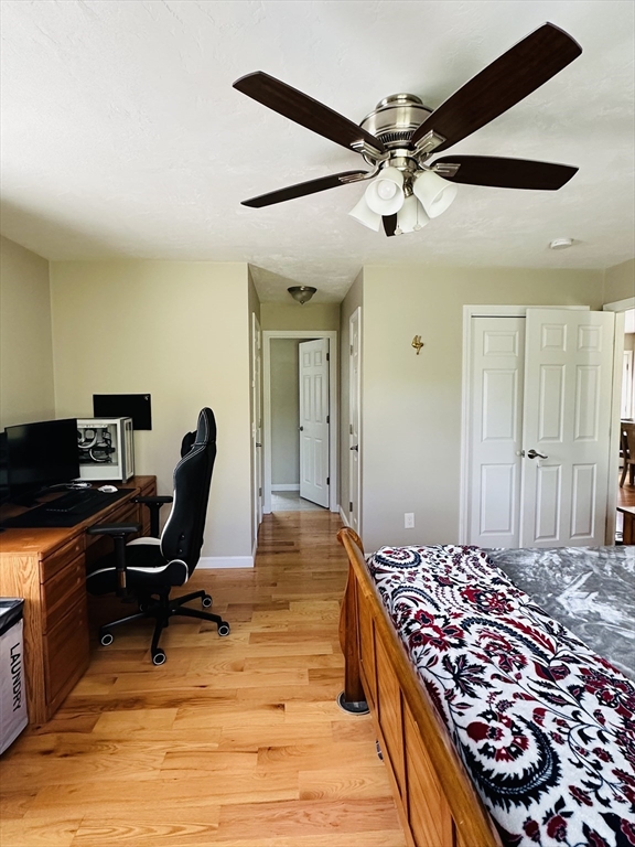 24 Dodge Road Charlton, MA 01507 - Photo 11 of 34 a bedroom with a large bed and a chandelier
