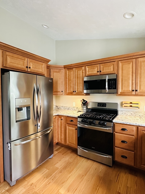 24 Dodge Road Charlton, MA 01507 - Photo 15 of 34 a kitchen with stainless steel appliances granite countertop a stove and a refrigerator
