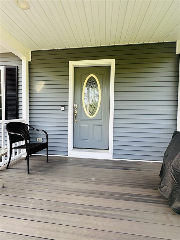 24 Dodge Road Charlton, MA 01507 - Photo 28 of 34 a front view of a house with entryway and wooden floor