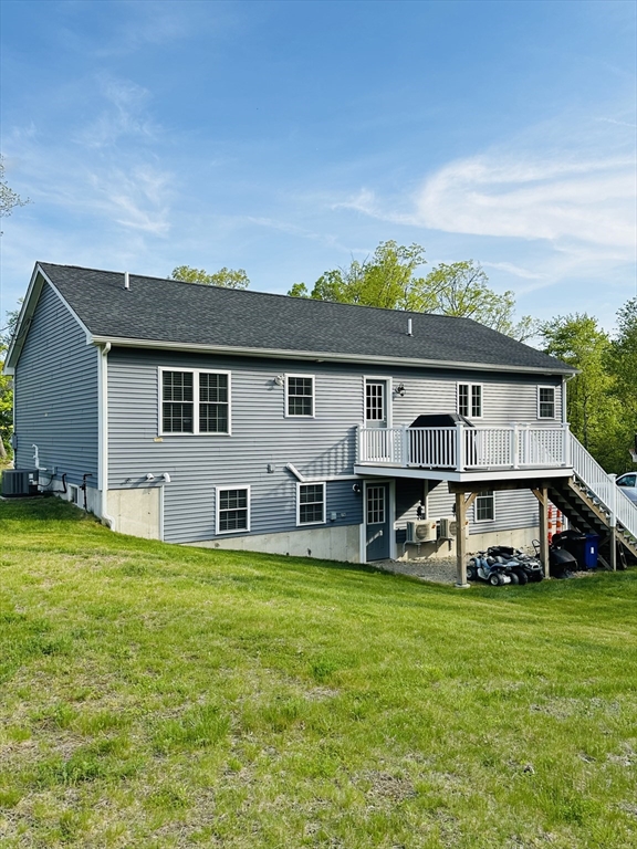 24 Dodge Road Charlton, MA 01507 - Photo 29 of 34 a front view of a house with a garden and trees
