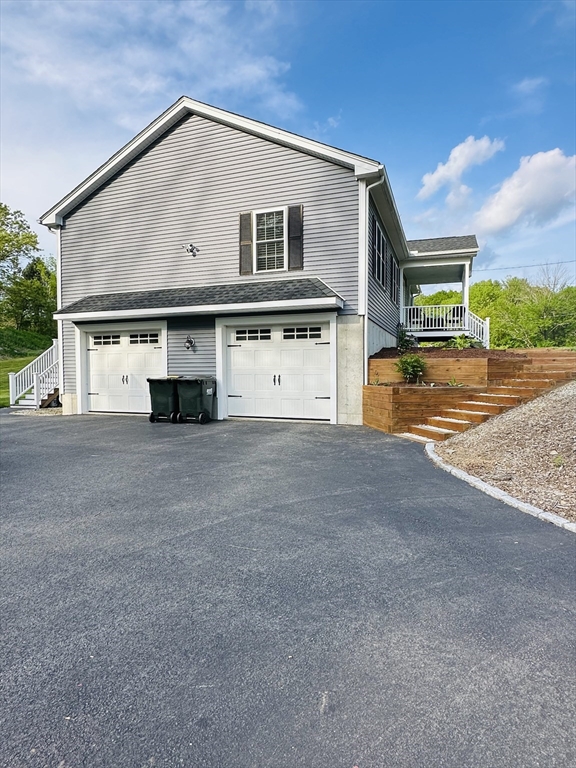 24 Dodge Road Charlton, MA 01507 - Photo 33 of 34 a front view of a house with a yard
