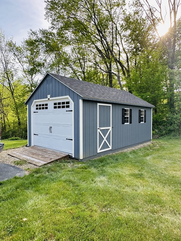 24 Dodge Road Charlton, MA 01507 - Photo 34 of 34 a front view of a house with a yard and garage