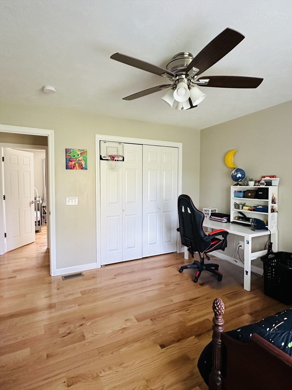 24 Dodge Road Charlton, MA 01507 - Photo 7 of 34 a workspace with wooden floor and ceiling fan