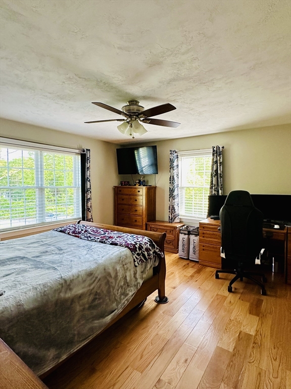 24 Dodge Road Charlton, MA 01507 - Photo 9 of 34 a bedroom with a bed and wooden floor