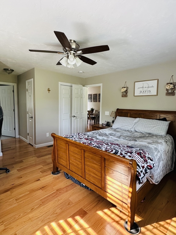 24 Dodge Road Charlton, MA 01507 - Photo 10 of 34 a bedroom with a bed and a chandelier