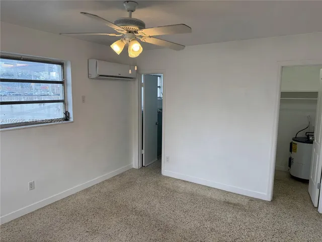 a view of a room with a fan and a fan