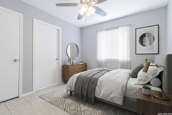 a bedroom with a bed and window