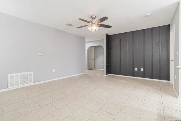 a kitchen with white cabinets stainless steel appliances and sink