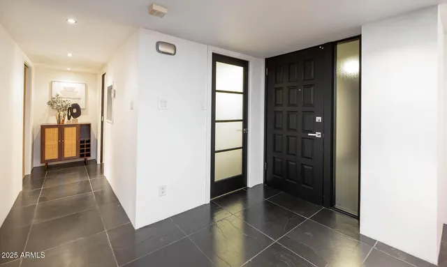 a bedroom with a bed and a view of bathroom