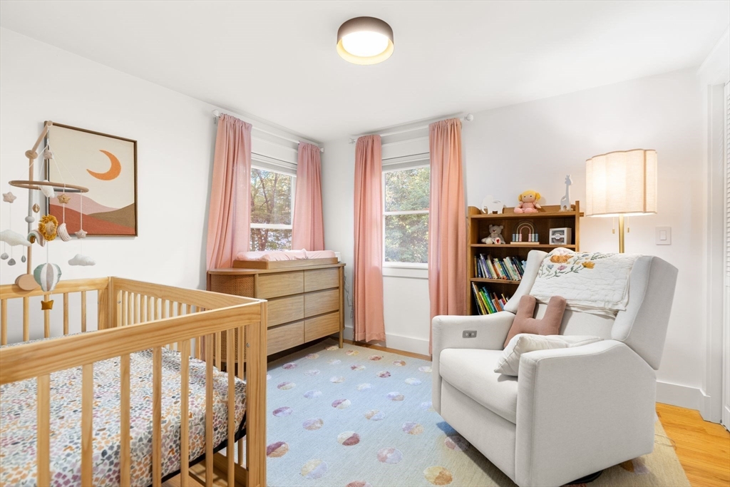 43 Oregon Road Ashland, MA 01721 - Photo 20 of 41 a living room with furniture and a baby crib