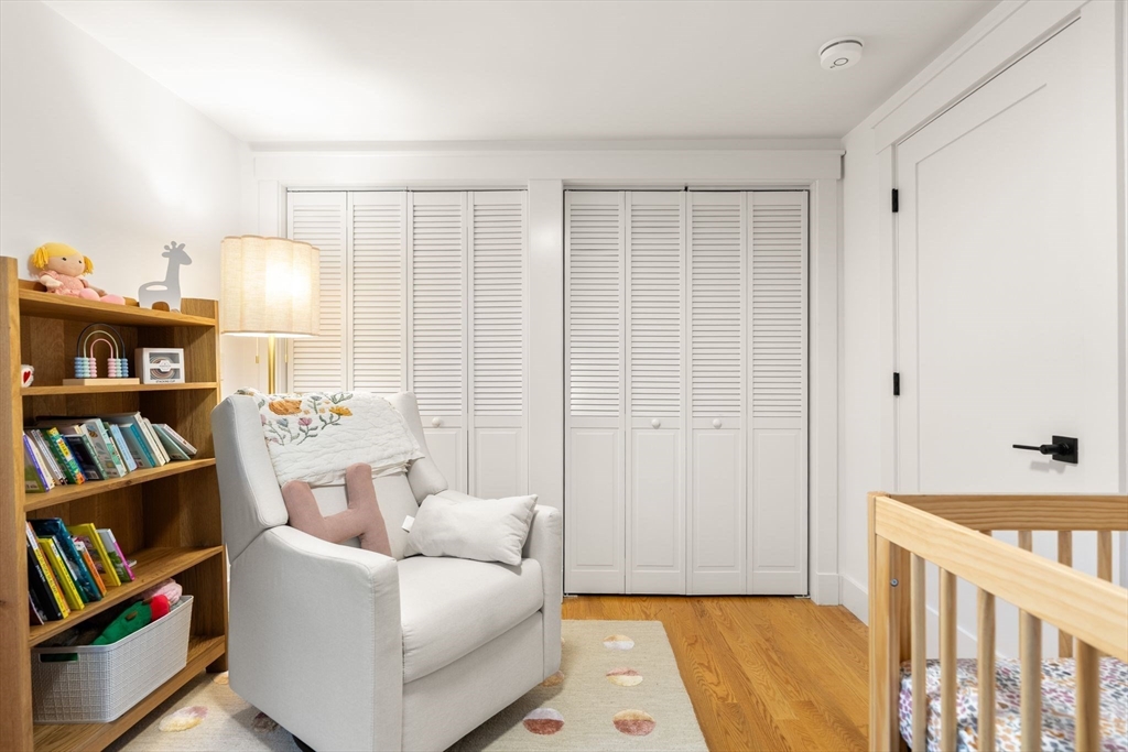 43 Oregon Road Ashland, MA 01721 - Photo 21 of 41 a bedroom with furniture and a book shelf