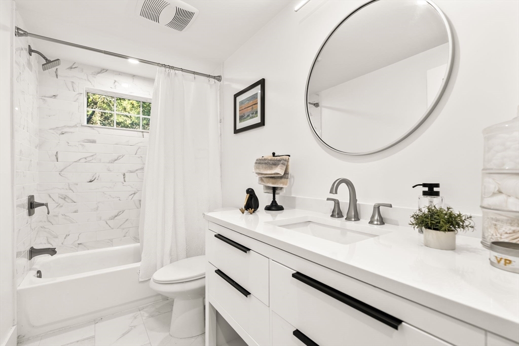 43 Oregon Road Ashland, MA 01721 - Photo 22 of 41 a bathroom with a sink a toilet and a mirror