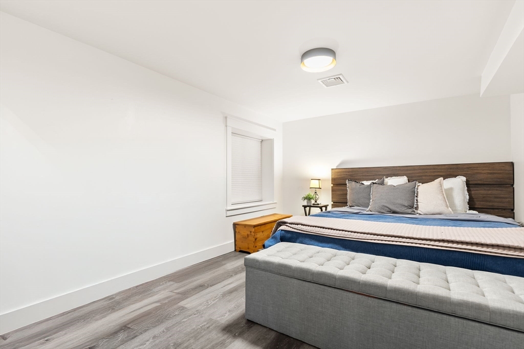 43 Oregon Road Ashland, MA 01721 - Photo 24 of 41 a bedroom with a bed and lamp