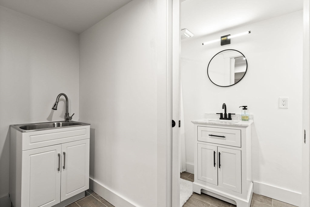 43 Oregon Road Ashland, MA 01721 - Photo 27 of 41 a room with a sink and a mirror