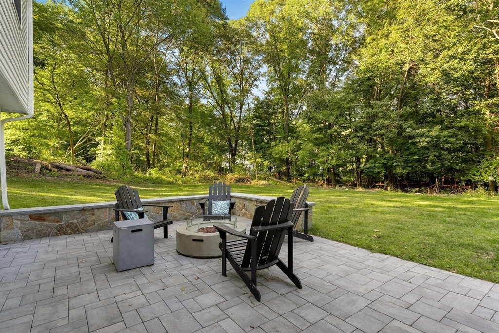43 Oregon Road Ashland, MA 01721 - Photo 30 of 41 a view of a patio with table and chairs potted plants and large tree