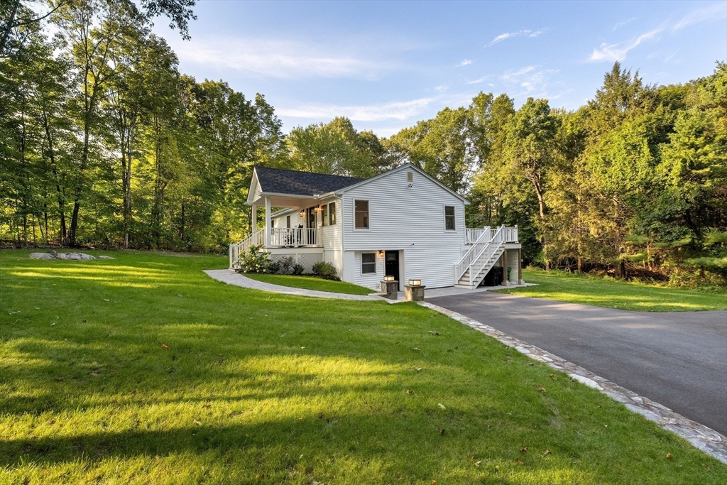 43 Oregon Road Ashland, MA 01721 - Photo 31 of 41 a front view of house with yard and green space