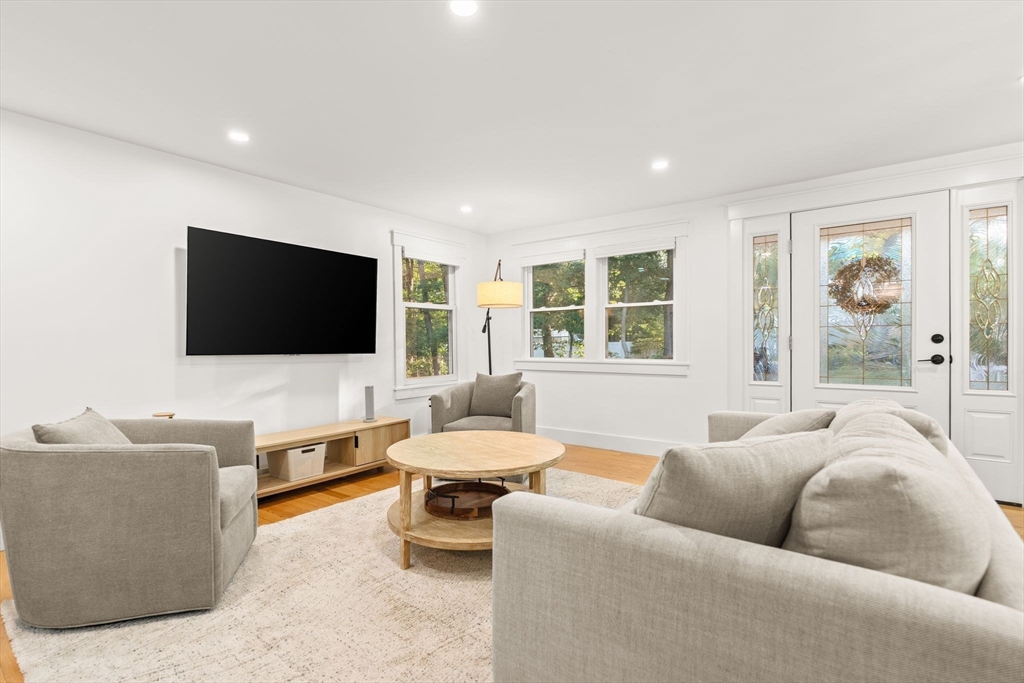 43 Oregon Road Ashland, MA 01721 - Photo 7 of 41 a living room with furniture and a flat screen tv