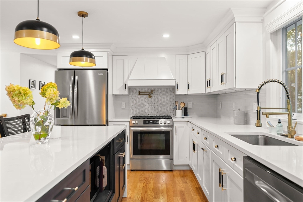 43 Oregon Road Ashland, MA 01721 - Photo 10 of 41 a kitchen with stainless steel appliances a stove a sink a refrigerator and a stove