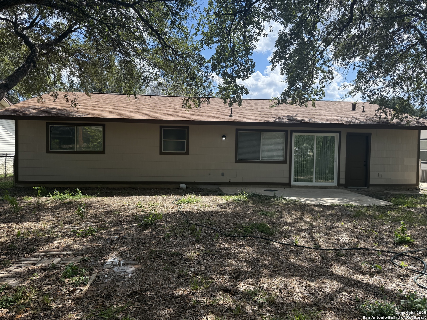 6831 Spring Rose Drive San Antonio, TX 78249 - Photo 18 of 18 a house with a tree in front of it