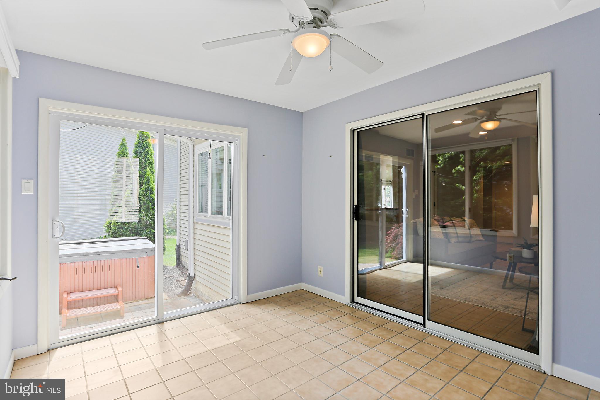 6914 Parchment Rise Columbia, MD 21044 - Photo 17 of 39 Sunroom with sliding glass door to patio & hot tub