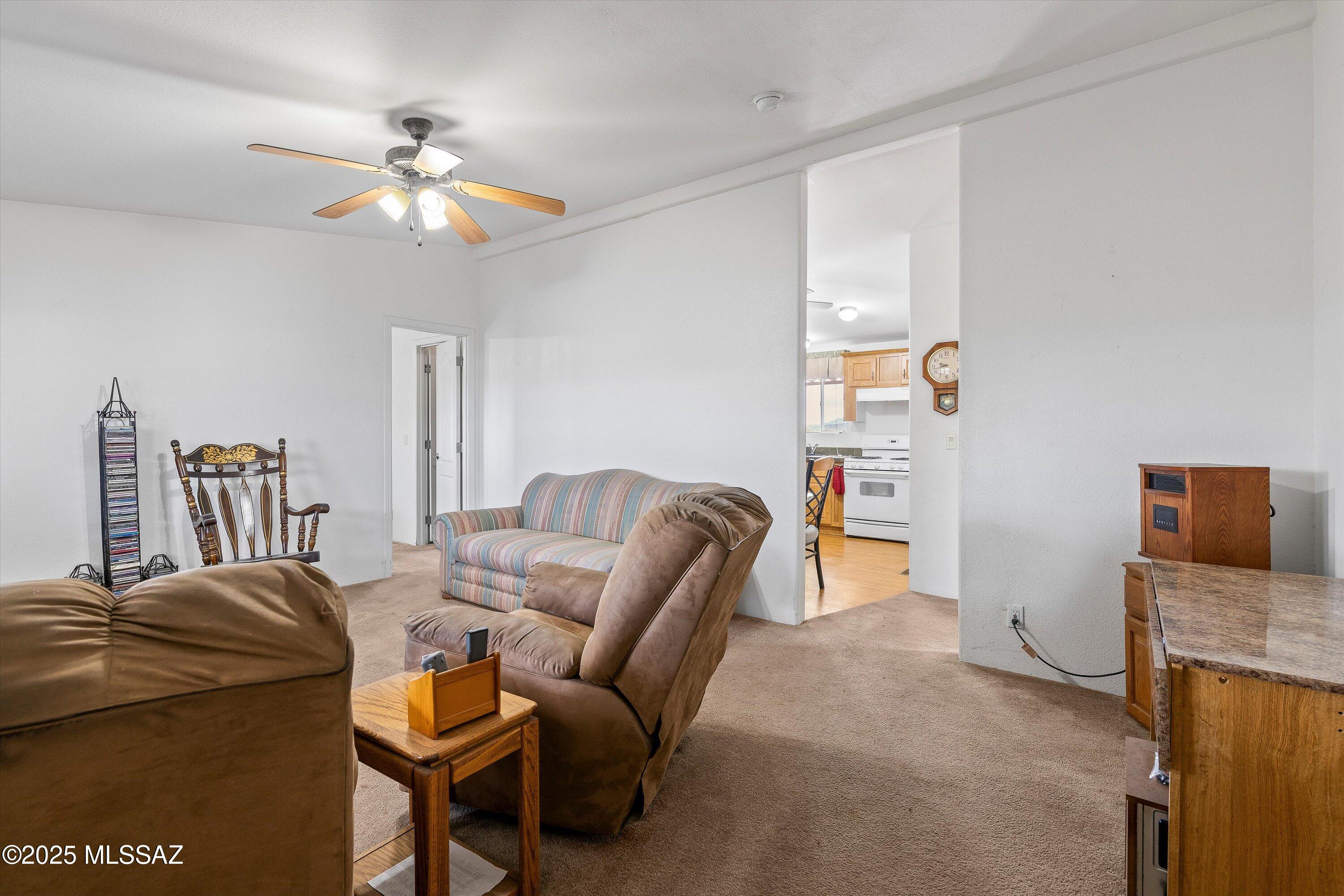 12055 North Musket Road Marana, AZ 85653 - Photo 6 of 17 Living room looking into Kitchen