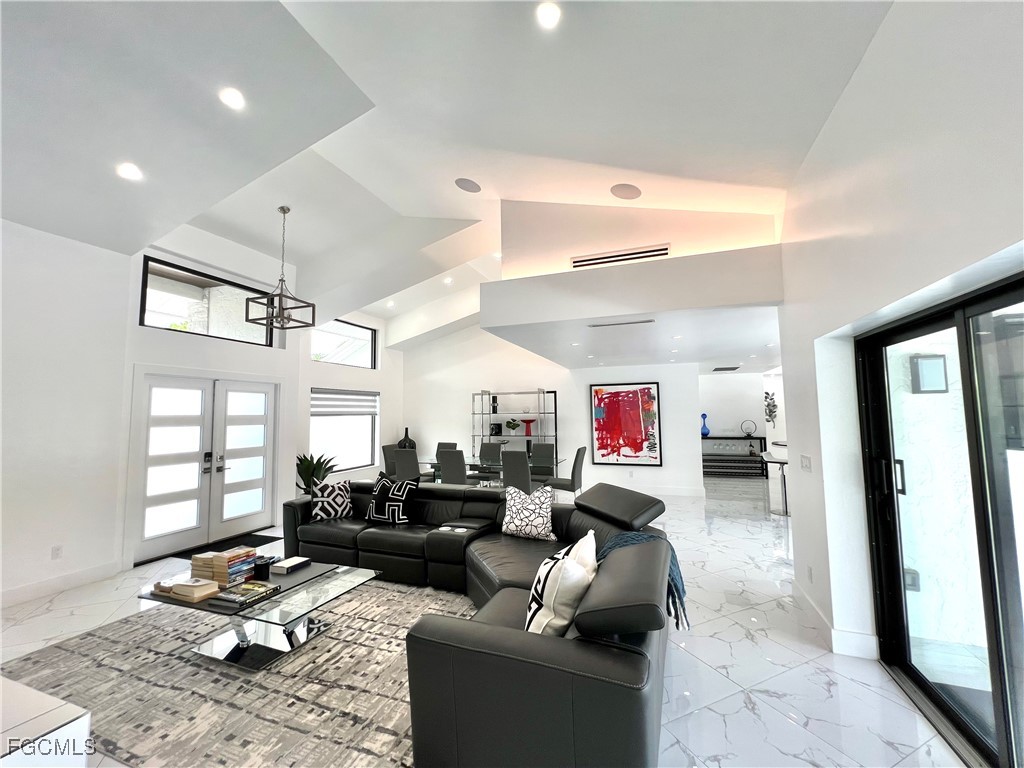 1919 Countess Court Naples, FL 34110 - Photo 11 of 30 a living room with furniture and a large window