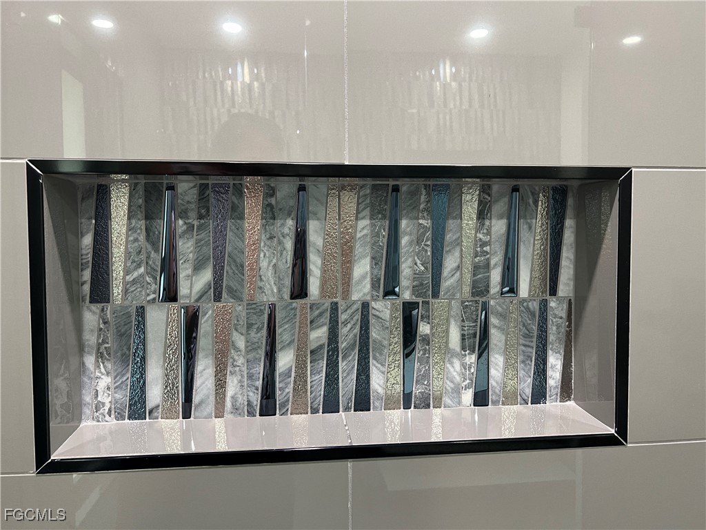 1919 Countess Court Naples, FL 34110 - Photo 21 of 30 a view of a porch with wooden floor and stairs