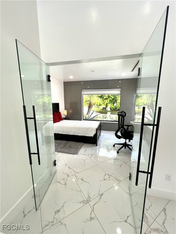 1919 Countess Court Naples, FL 34110 - Photo 23 of 30 a living room with furniture and a flat screen tv