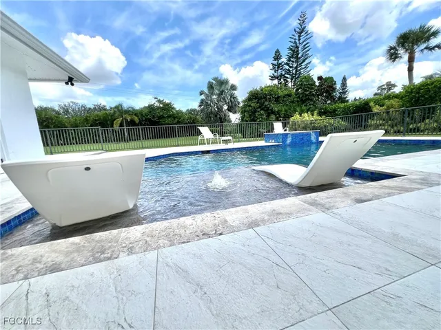 a view of outdoor space and swimming pool