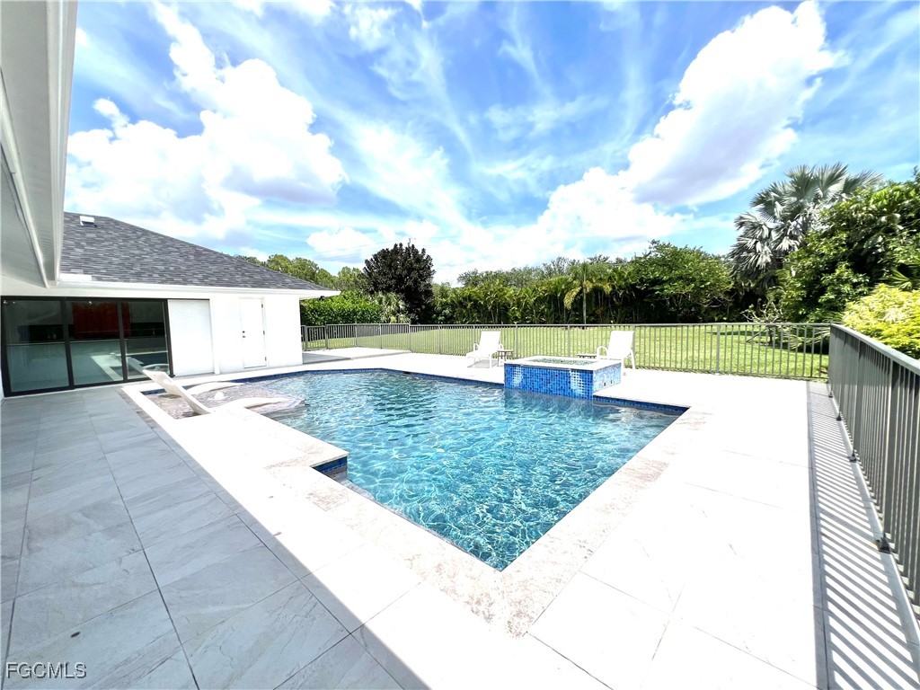 1919 Countess Court Naples, FL 34110 - Photo 28 of 30 a view of a house with a yard