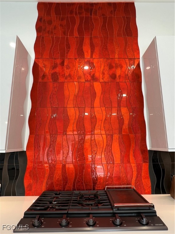 1919 Countess Court Naples, FL 34110 - Photo 6 of 30 a room with a door and wooden floor