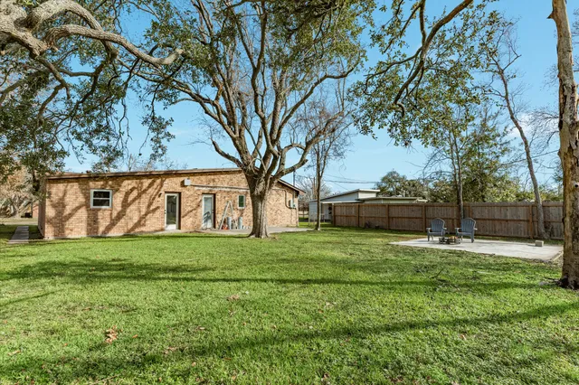 a backyard of a house with lots of green space