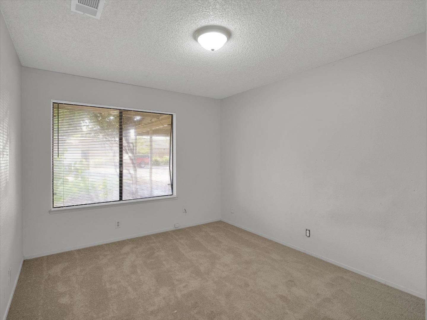 3559 Vernal Avenue Merced, CA 95340 - Photo 12 of 25 an empty room with a window